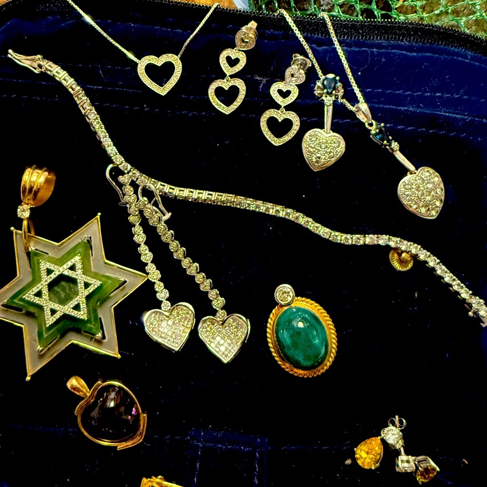 White and Yellow gold, precious stones, many are my designs.
